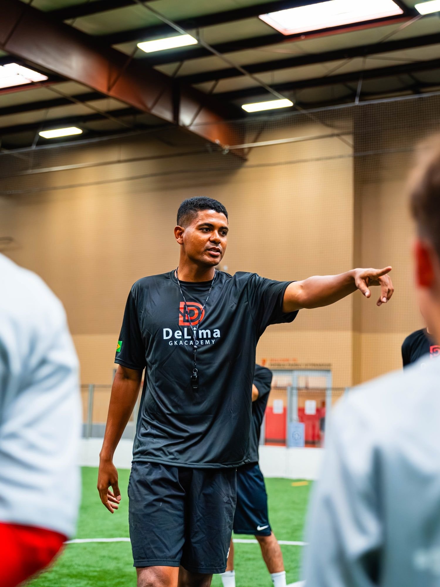 Coach Claysson De Lima giving instructions during an indoor goalkeeper session