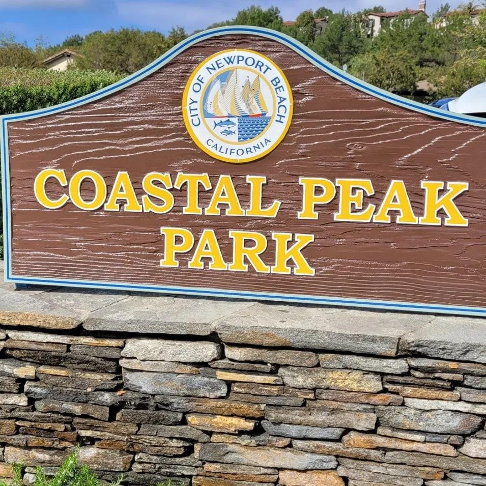 Coastal Peak Park entrance sign with the City of Newport Beach seal in Newport Coast